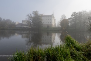 Bor castle in the mist and ducks