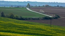 Bukovany wind mill and orchard with field